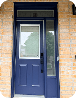 The freshly painted navy blue front door after the transformation.