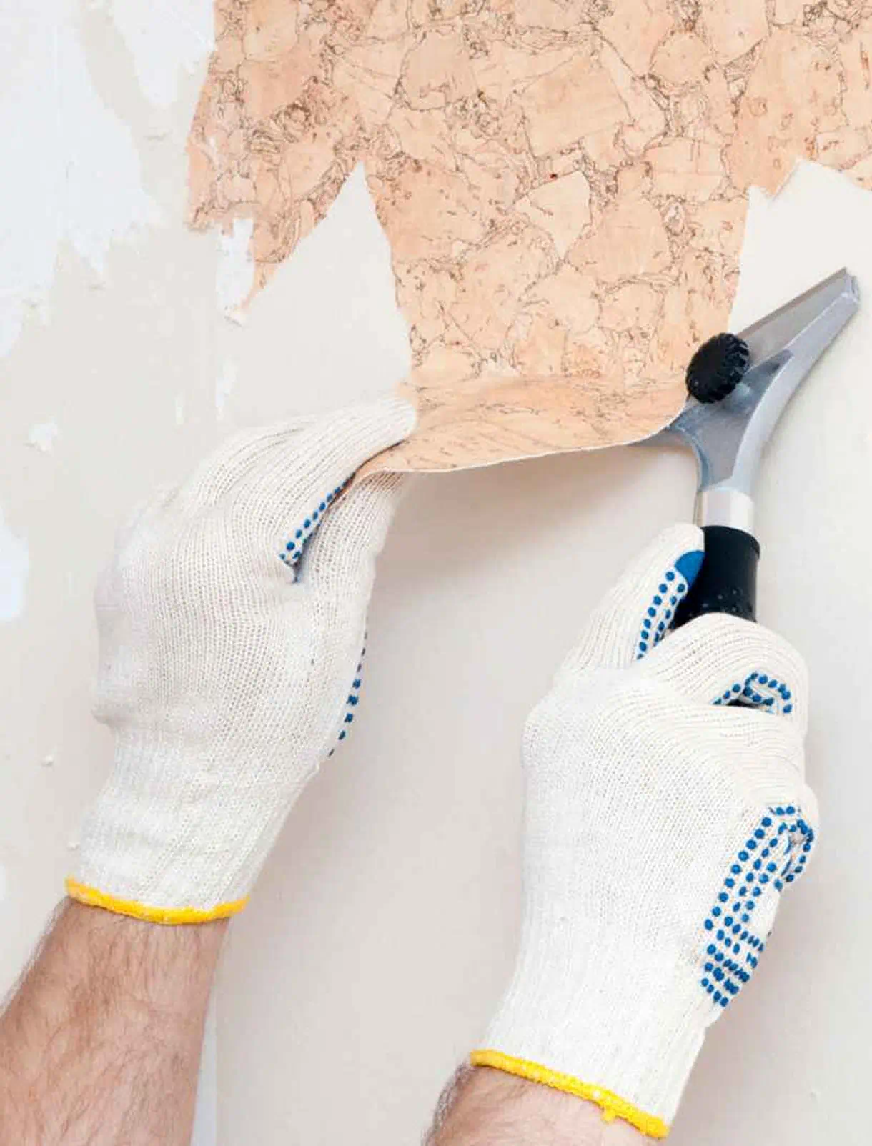 Wallpaper being removed from an interior wall